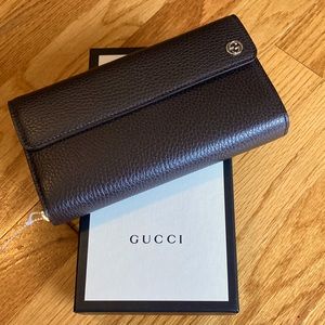 Gucci wallet, gorgeous chocolate brown with gold hardware.